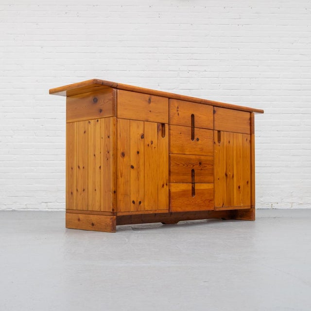 Italian Brutalist 1960s sideboard designed by Silvio Coppola and produced by Fratelli Montina. Crafted from solid pine...