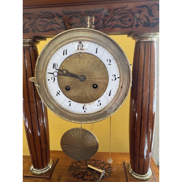The woodwork has been restored and is functional, but should be checked by a watchmaker. Key included.