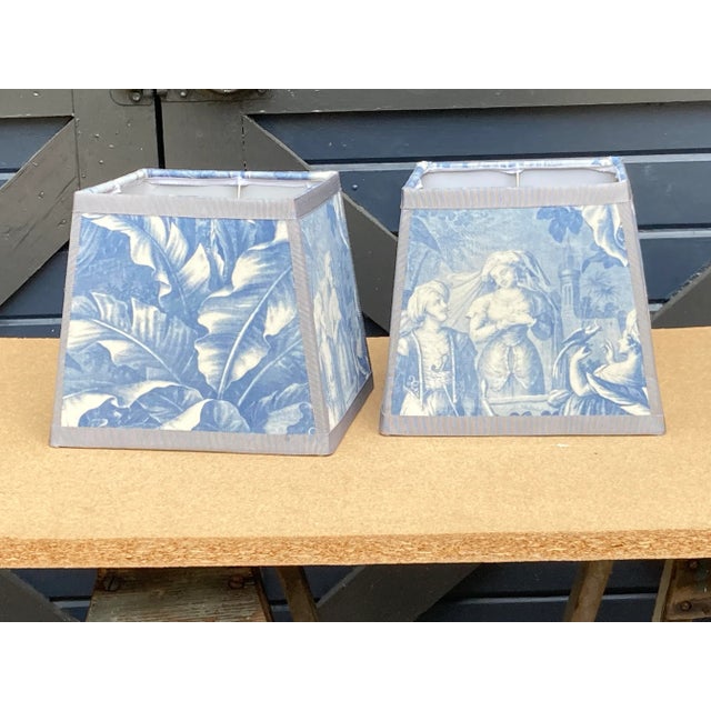 A pair of square lampshades handmade from a reproduction toile depicting harem scenes. Top 7” side 8” bottom9”