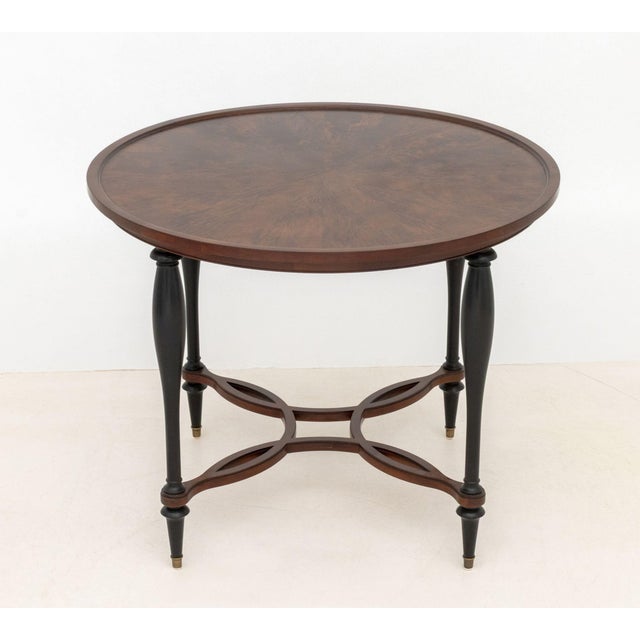 Baker Furniture Circular Center Table, burlwood top over tapering ebonized legs and interlocking stretchers, Baker label...