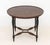 Baker Furniture Circular Center Table, burlwood top over tapering ebonized legs and interlocking stretchers, Baker label...