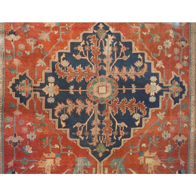 An incredible mid-19th century Persian Serapi rug woven by a highly skilled master weaver! The central medallion is...