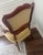 This armchair, likely from the early 19th century, showcases the robust and elegant design typical of the period. Its...