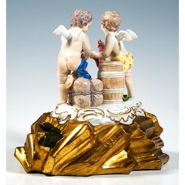 Excellent piece of Meissen porcelain of the 18th century: Two scantily clad, winged cherubs conducting business: one...
