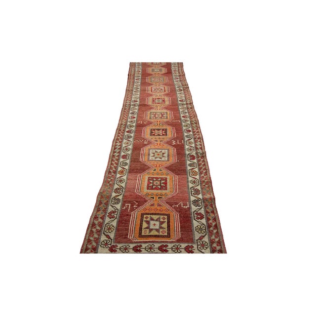 Vintage decorative runner rug from South Eastern Turkey. Approximately 55-65 years old. In very good condition