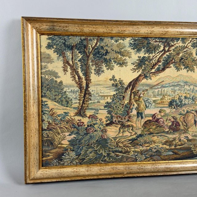 A rare and exquisite tapestry in classical French style, depicting an evocative bucolic scene immersed in a lush woodland...