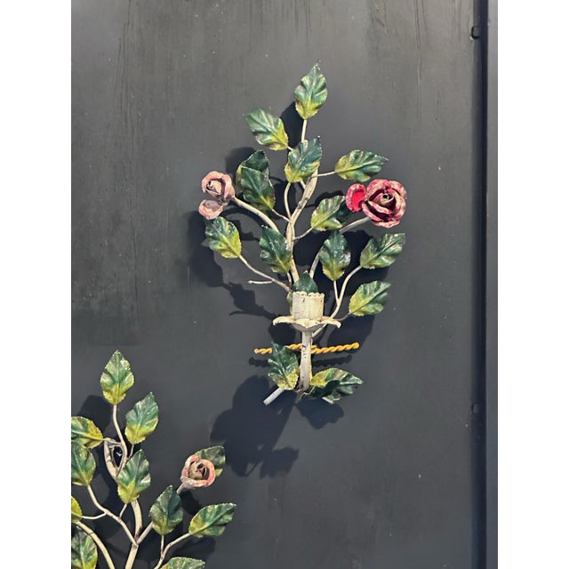 Rose lovers candle sconces in richly painted greens reds and pinks. Very sturdy metal work.