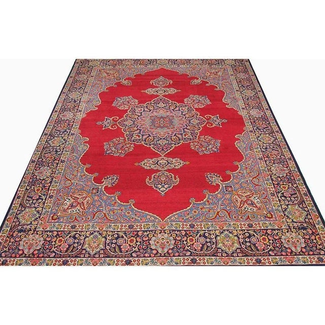 ACTUAL SIZE: 9’7″ x 12’7″ PRIMARY COLOR: Red / Navy AGE: Old MATERIALS: Wool FOUNDATION: Cotton PRODUCTION: Handwoven,...