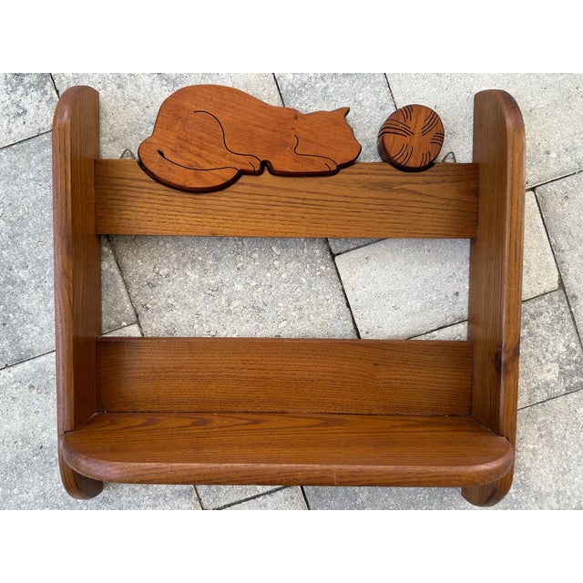 Vintage solid oak wood cat shelf to hang on the wall. Measures 17” long x 17” wide x 6” deep.