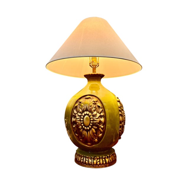Bring a burst of vintage charm and bold color into your space with this striking mid-century ceramic table lamp. Featuring...