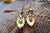 Gold earrings with leaf-shaped reliefs on an articulated pendant. Metal: Gold. Origin: Portuguese. Brand: Dragão. Weight:...