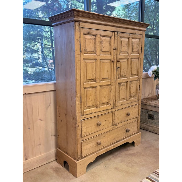 An exceptional 19th-century Irish scrub pine clothing armoire, distinguished by its beautifully weathered honey-toned...