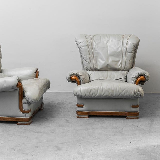 Pair of armchairs. Wooden frame and gray leather upholstery. Good condition with signs of wear, as shown in photos.
