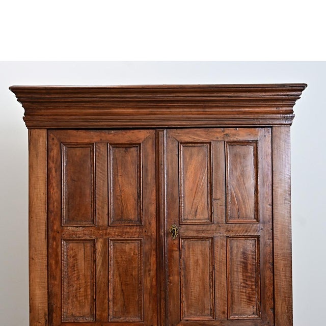 An extraordinary Dutch wardrobe made in the late Renaissance period, 18th century, this substantial storage piece is all...
