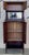 The Vertiko made from walnut with brass fittings, a mirror with facet cut, with typical Art Nouveau ornamentations. In...