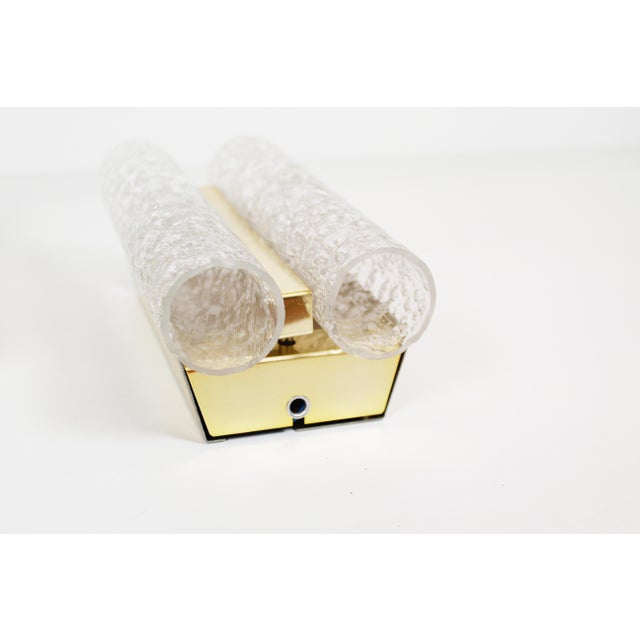 Set of wall lamps in plated brass and glass by the German company Doria Leuchten. In very beautiful condition without...