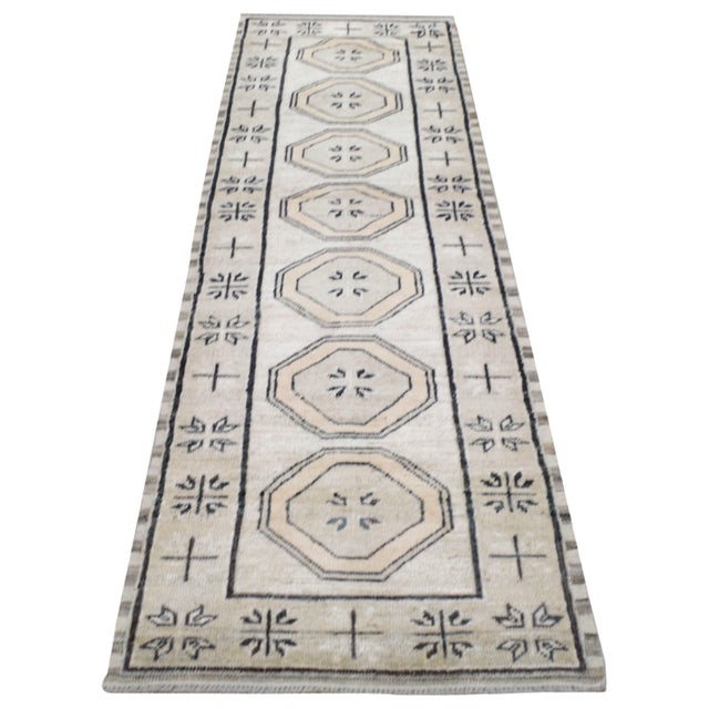 Hand-knotted with care using traditional rug making techniques, this wool rug blends timeless craftsmanship with a modern...