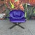 Lounge chair by Ligne Roset featuring purple leather and chrome base.