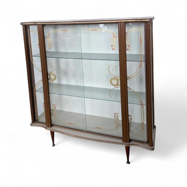The Formica drinks cabinet is a mid-century display cabinet designed to serve as a vintage cocktail bar and retro drinks...
