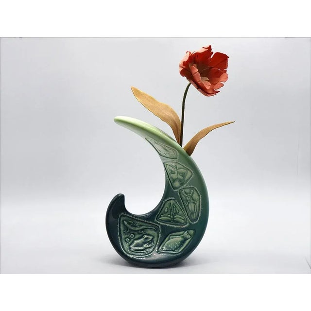 Sinuous ceramic vase mase in Italy 1960s. Of curved shape with relief decoration and shaded glaze. In excellent condition