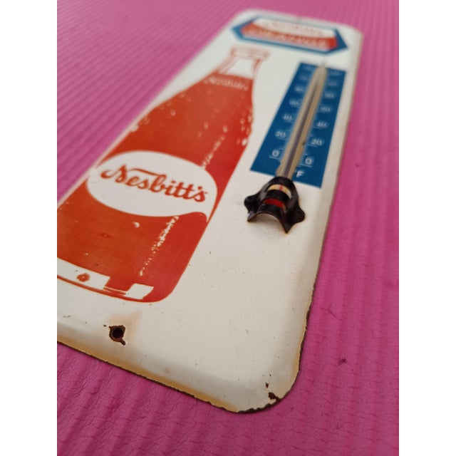 Capture the vibrant charm of mid-century Americana with this exquisite Vintage-Style Nesbitt's Orange Soda Metal...