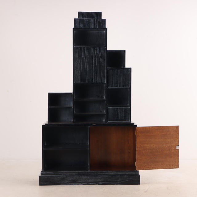 This magnificent vintage bookcase is made in the style of Paul Frankl's famous Skyscraper Furniture of the 1920s. A...