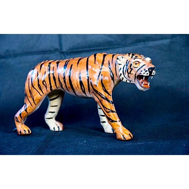 A spectacular Italian sculpture depicting a tiger in motion, mouth open, dating from the 1960s–1970s. with its elegant...