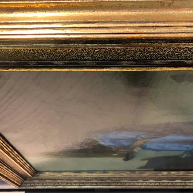 Beautiful reproduction Vermeer painting in a gilt frame. This piece is oil on canvas. Canvas is secured to a wood frame...