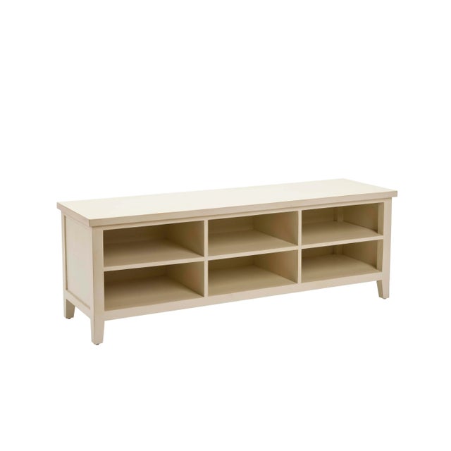 The low-slung bookshelf, in vintage shady white finish, will prove a versatile addition to casual country-loving settings....