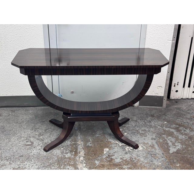 Design Plus Gallery presents an Macassar Ebony Console Table from C. Mariani Antiques. The console table is in an Art Deco...
