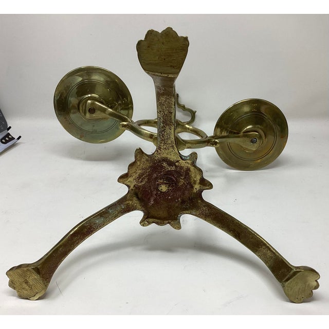 19th C Brass 2 arm adjustable candleholder with 3 claw feet.