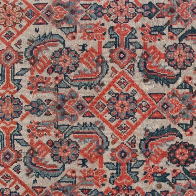 A 19th century Persian Semmeh carpet woven in a Herati pattern consisting of floral and leaf motifs surrounded by a...