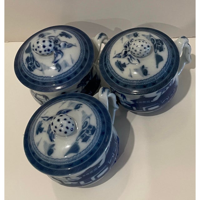 A set of three lidded pot de creme porcelain lidded cups in the Canton pattern by Mottahedeh. This pattern was created for...