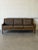 This classic three-seater sofa features a streamlined silhouette with gentle curves and a relaxed seating profile. The...