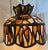 First half 20th century, folk art style, domed pendant chandelier having polychrome, stained glass mosaic style shade in...