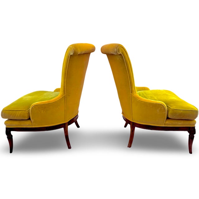 Elegant 1930's chairs featuring a distinct tall, flared back that slightly curves outward, contributing to a dramatic...