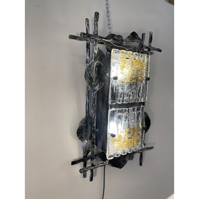 Swedish brutalist wall lamp in patinated wrought iron and murano glass from a+e leuchte between 1960's and 1970's. -...