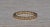 The Pandora: Yellow Gold Pandora Signed Bead Eternity Band. The band features beaded granulations around the entire ring....