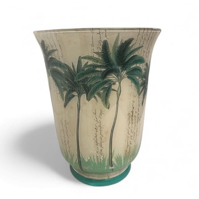 This stunning, handcrafted glass vase offers a blend of tropical charm and vintage appeal, perfect for adding a touch of...