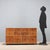 Vintage walnut cabinet with burnished brass hinges, as are the handles on the sixteen drawers. The drawers vary in size,...