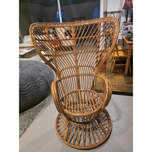 This distinctive peacock chair design emerged during the mid-century modern period when Italian designers like Gio Ponti...