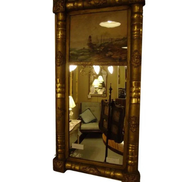 19th-20th century Federal style crest mirror in a very fine water gilt bamboo form frame. The reflection from a hanging...