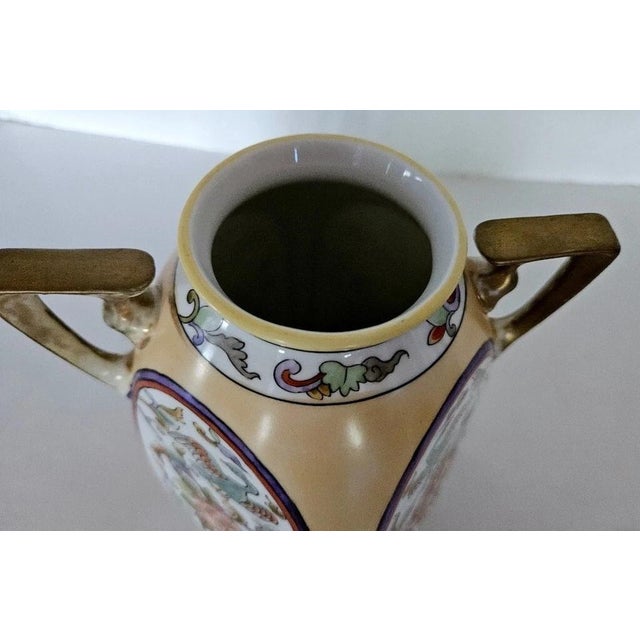 This antique Nippon Morimura two-handled square vase showcases elegant hand-painted floral and bird details with beautiful...