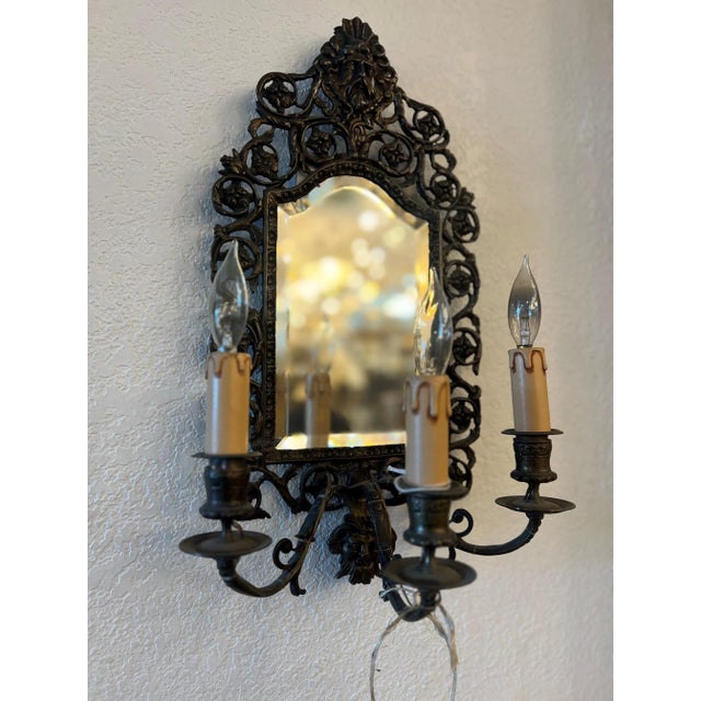 From the late 19th century pair of American Gilt bronze and beveled mirror Sconces. Originally candle, now rewired and...