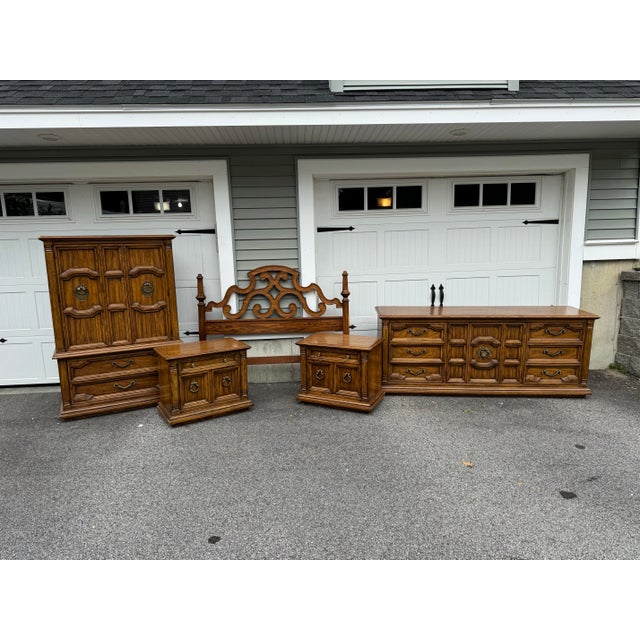 An exceptional, heirloom-quality 5-piece bedroom suite by renowned American manufacturer Thomasville, circa 1970s. This...