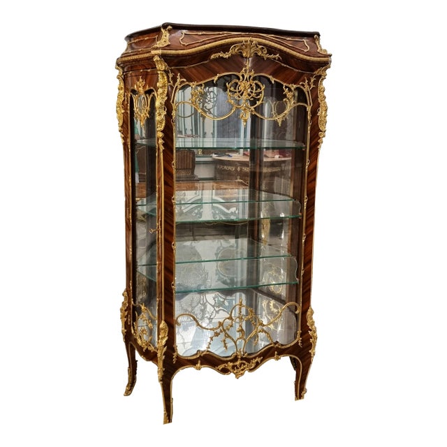 Ornate French Louis XV Curio Cabinet – Glass Shelving, Gilded Accents & Graceful Bombe Design For Sale