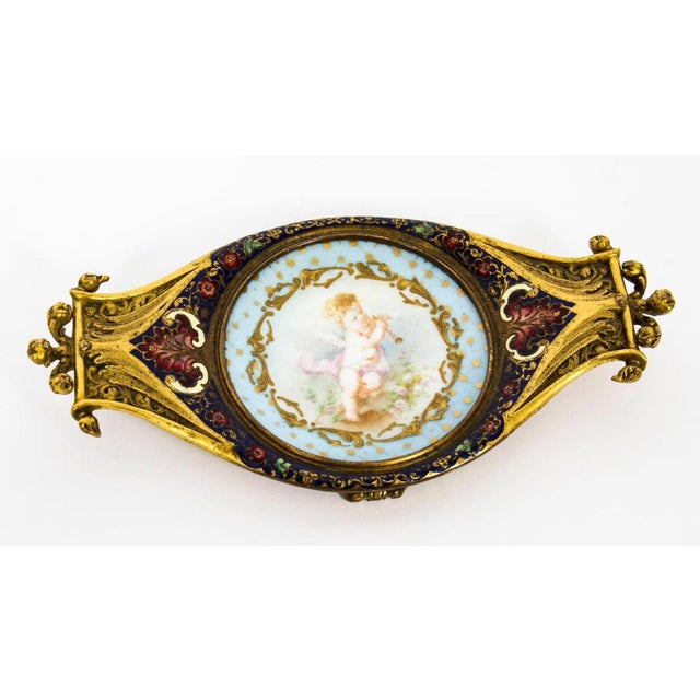 A really beautiful French ormolu, champlevé enamel and Sèvres Porcelain pin tray, circa 1880 in date. The ormolu and...