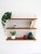 Wall system with three adjustable teak shelves and white lacquered metal side structure. Hylla wall system of Scandinavian...
