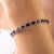 This elegant art deco style tennis bracelet features octagon cut blue sapphires totaling 10.78 carats, set in 18K white...