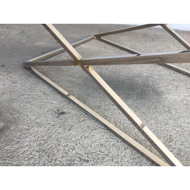 Chrome "X" base glass top coffee table with a glass top. Attributed to the designer Granger Hertzog.